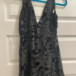 Black, sequined mini dress. Perfect for holiday parties. Worn once.